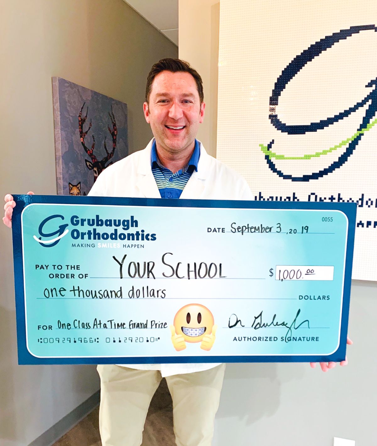Dr. Grubaugh with Enter to win $1000 for your School check